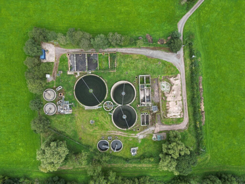 Aerial view of a wastewater treatment plant that requires chemical solutions.